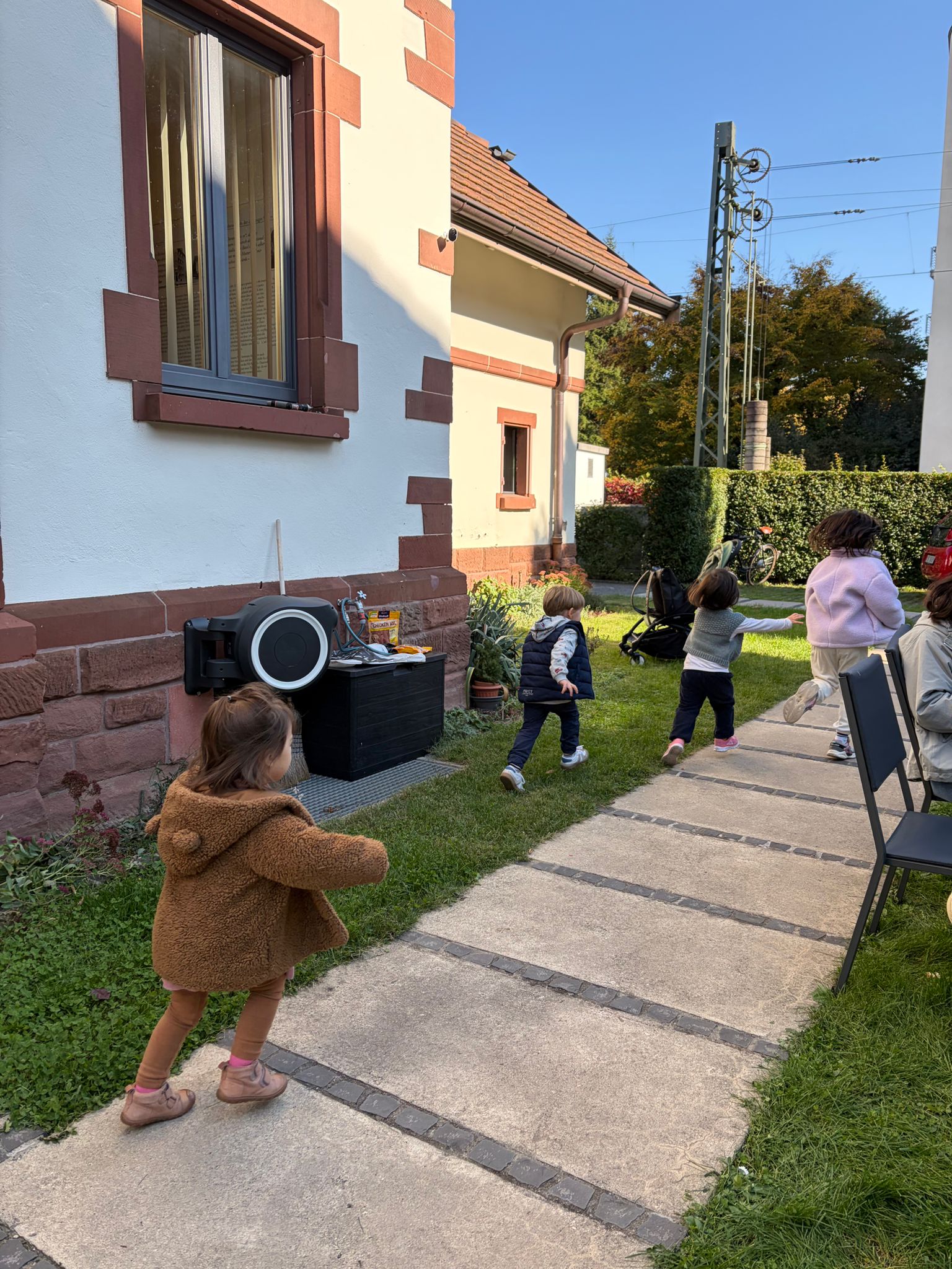 Between conversations, children turned the garden into a playground.